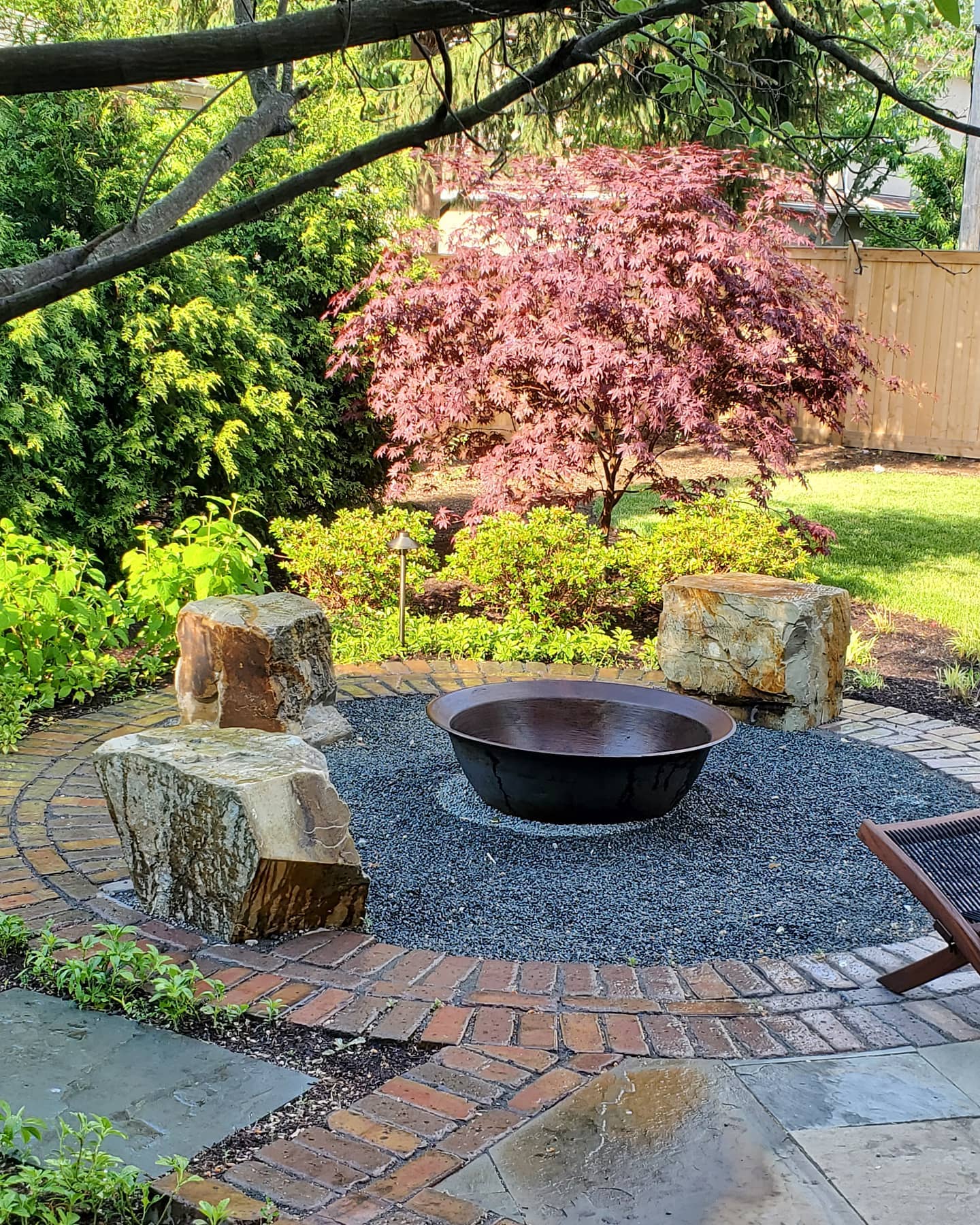 Fire pit circle with Japanese maple